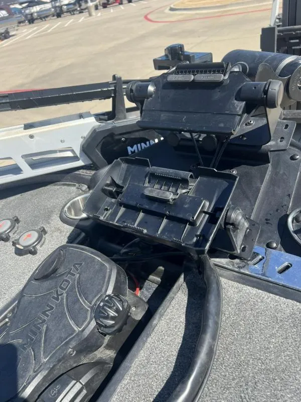 Slide: The Image of 2015 Triton 20TRX boat with Minn Kota trolling motor and equipment on deck. - 9