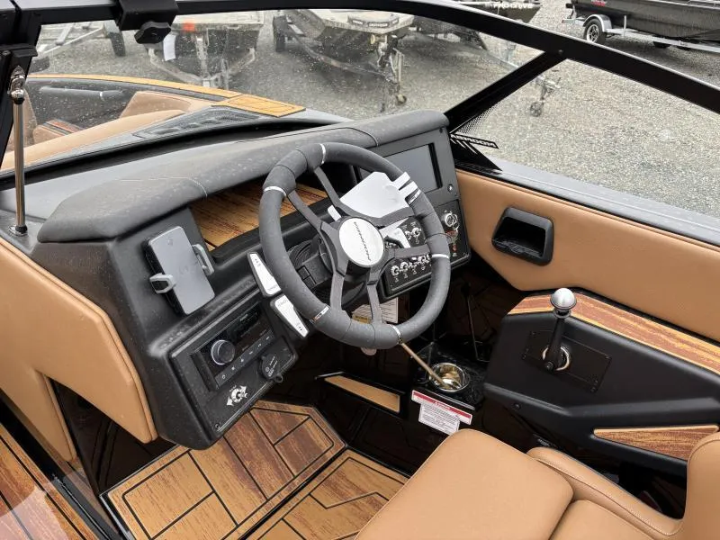 Slide: The Image of 2025 Moomba Max boat interior with modern dashboard and steering wheel design. - 19