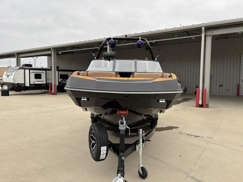 Slide: The Image of 2025 Moomba Max boat on trailer in outdoor storage area. - 2