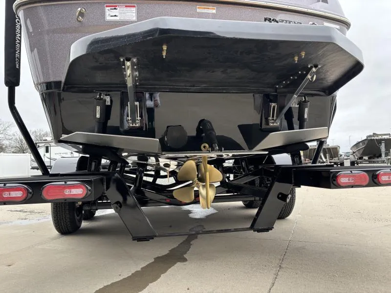 Slide: The Image of 2025 Moomba Max boat on trailer, showcasing propeller and rear design. - 6