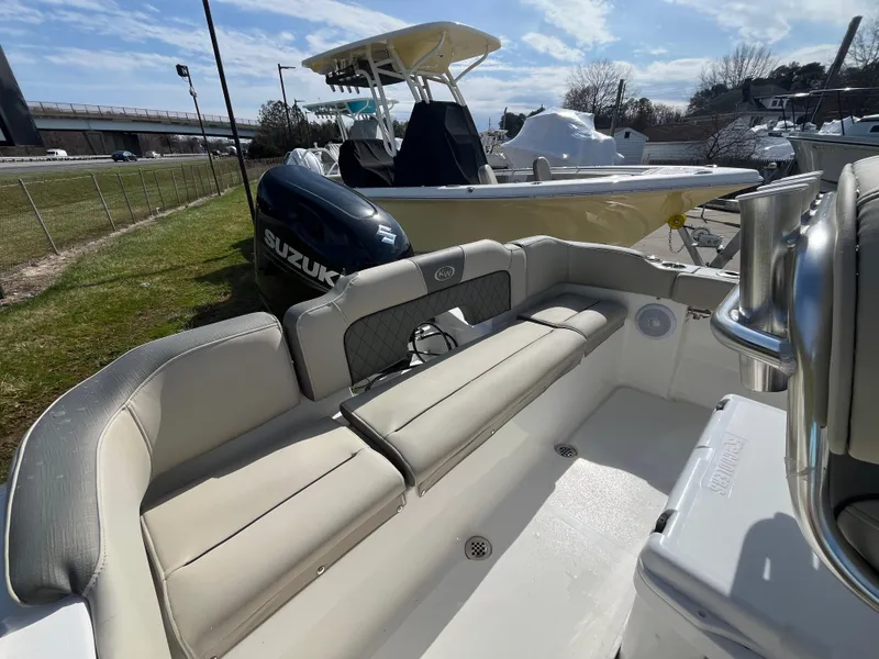 Slide: The Image of 2025 Key West 203 FS boat with Suzuki engine, featuring spacious seating and sleek design. - 13
