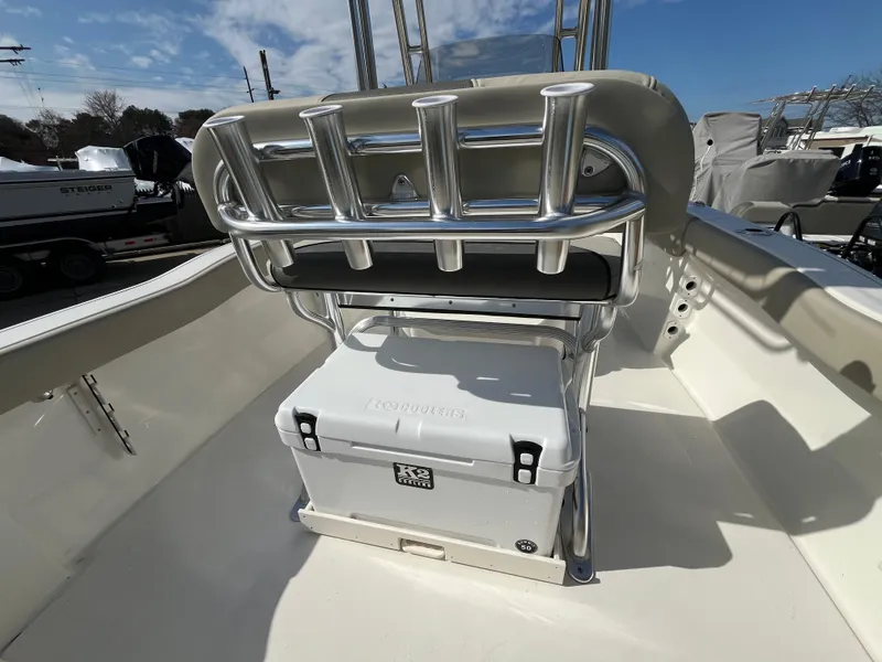 Slide: The Image of 2025 Key West 203 FS boat interior with rod holders and cooler under seat. - 16