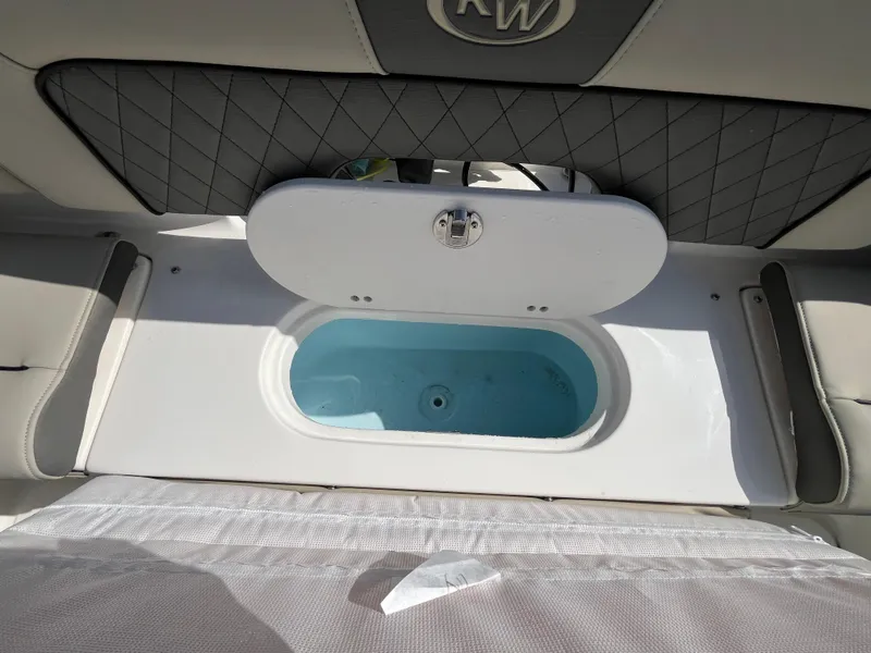 Slide: The Image of 2025 Key West 203 FS boat interior with open storage compartment. - 17
