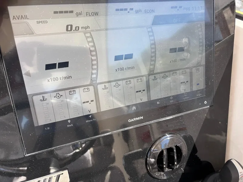Slide: The Image of Garmin display on 2025 Pursuit OS 355 Offshore boat showing speed and engine data. - 23