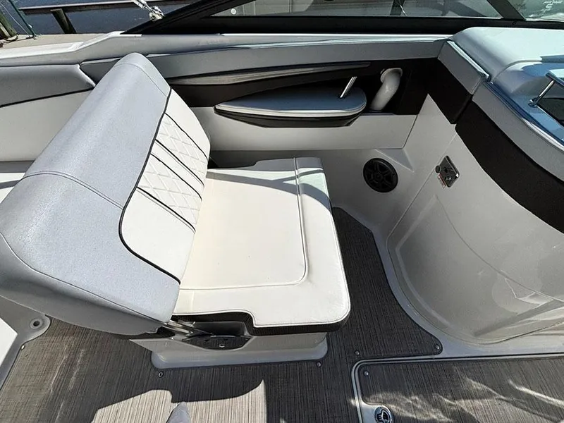 Slide: The Image of 2016 Sea Ray 240 Sundeck interior with gray seating and sleek design. - 10