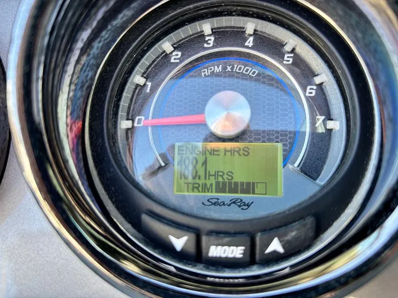 Slide: The Image of Close-up of a 2016 Sea Ray 240 Sundeck tachometer displaying engine hours. - 18