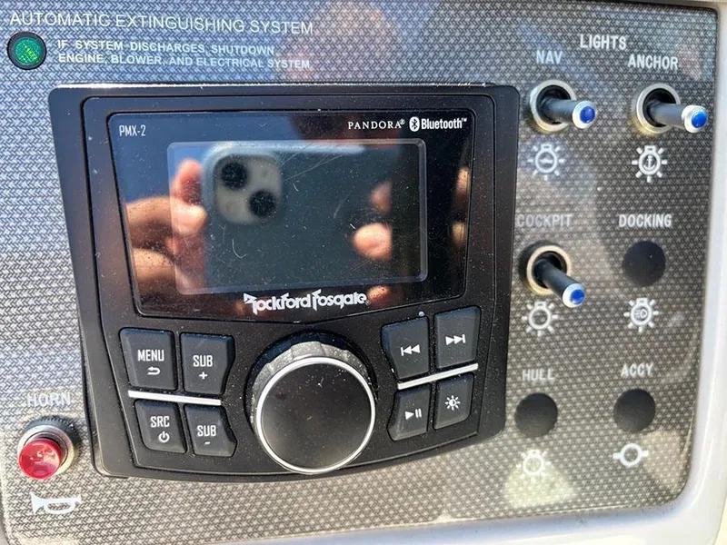 Slide: The Image of Control panel of a 2016 Sea Ray 240 Sundeck with Rockford Fosgate audio system. - 20
