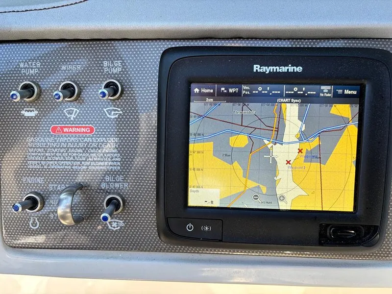 Slide: The Image of Control panel of a 2016 Sea Ray 240 Sundeck with Raymarine navigation display. - 21