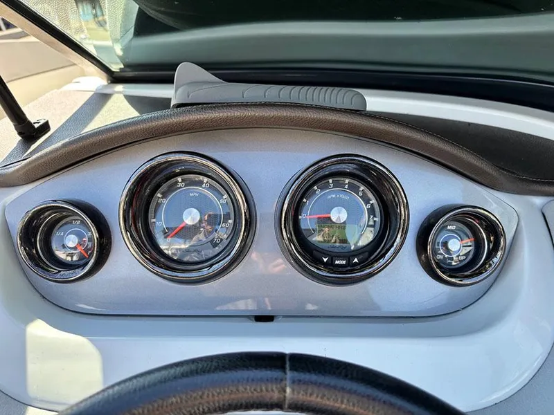 Slide: The Image of Dashboard gauges of a 2016 Sea Ray 240 Sundeck boat. - 22