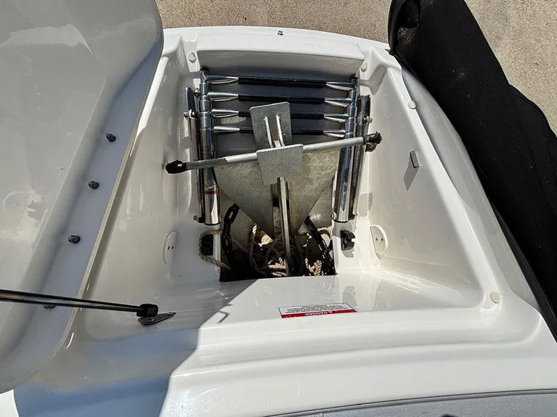 Slide: The Image of Anchor storage compartment on a 2016 Sea Ray 240 Sundeck boat. - 26