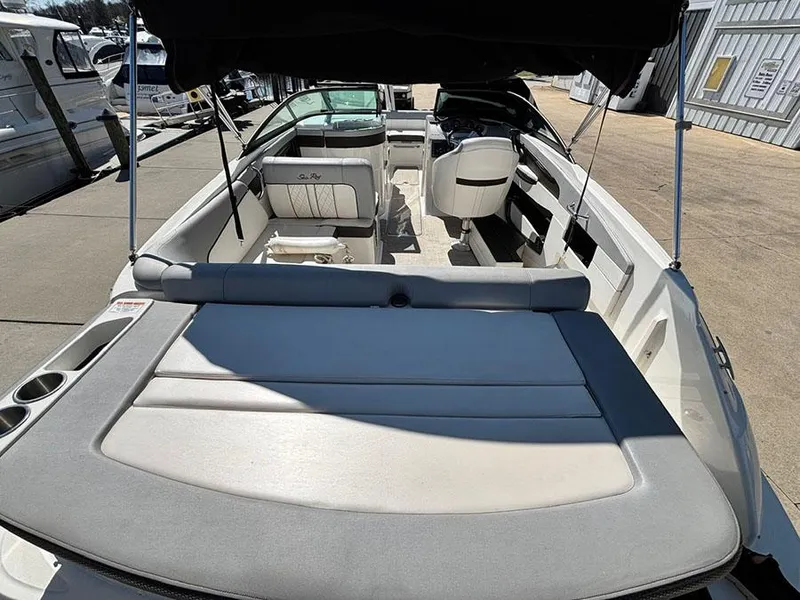 Slide: The Image of 2016 Sea Ray 240 Sundeck boat interior with seating and sunshade. - 5
