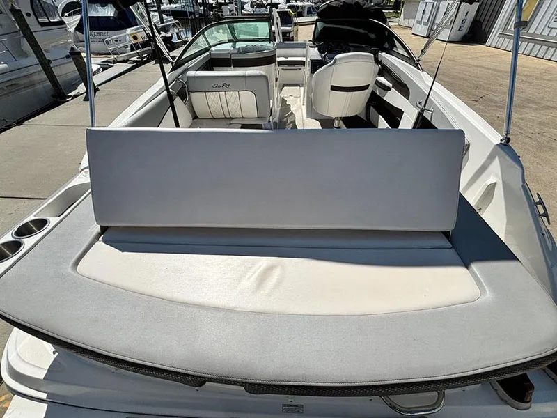 Slide: The Image of 2016 Sea Ray 240 Sundeck boat interior with seating and open deck view. - 6