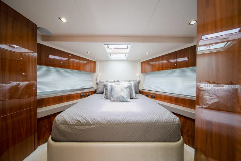 Slide: The Image of Luxurious bedroom interior of 2020 Sunseeker 52 Manhattan yacht with elegant wood finishes. - 11