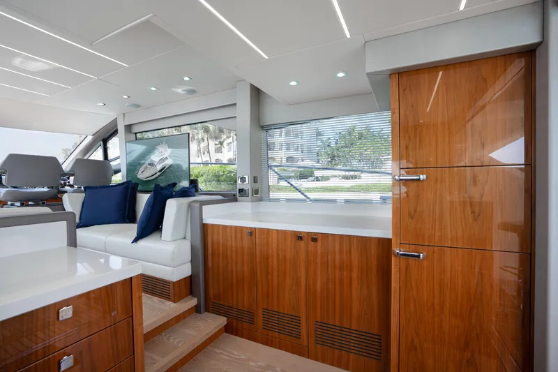 Slide: The Image of Luxurious interior of 2020 Sunseeker 52 Manhattan yacht with sleek wood finishes and modern design. - 12