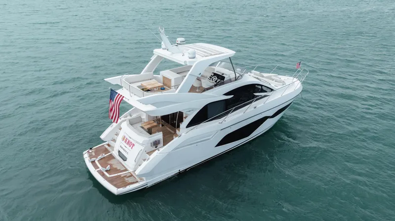 Slide: The Image of 2020 Sunseeker 52 Manhattan yacht cruising on open water. - 2