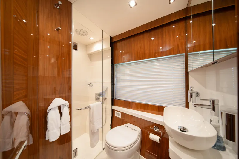 Slide: The Image of Luxurious bathroom in 2020 Sunseeker 52 Manhattan yacht with modern fixtures and wood accents. - 22
