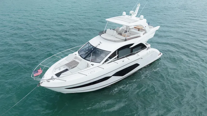 Slide: The Image of Luxurious 2020 Sunseeker 52 Manhattan yacht cruising on open water. - 3