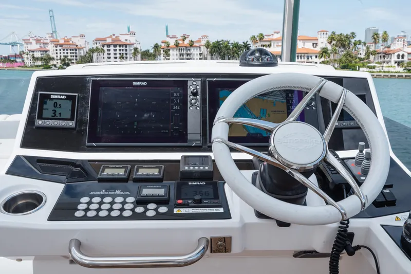 Slide: The Image of Helm of 2020 Sunseeker 52 Manhattan yacht with advanced navigation systems. - 33