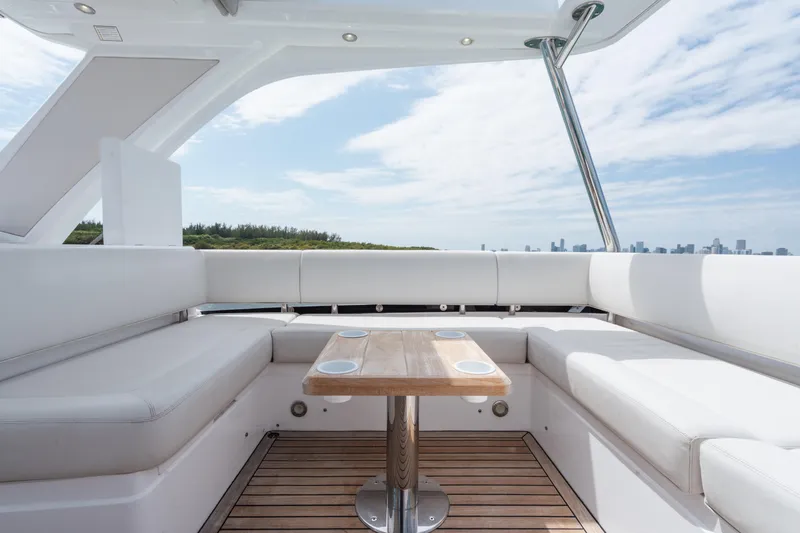 Slide: The Image of Luxurious Sunseeker 52 Manhattan yacht interior with white seating and wooden table, 2020 model. - 36