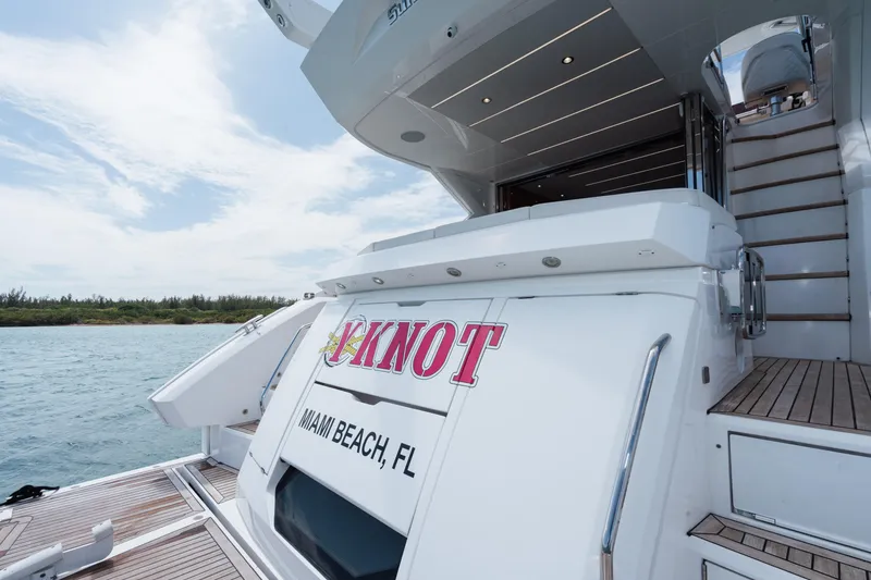 Slide: The Image of Sunseeker 52 Manhattan yacht, rear view, docked in Miami Beach, Florida, 2020 model. - 38