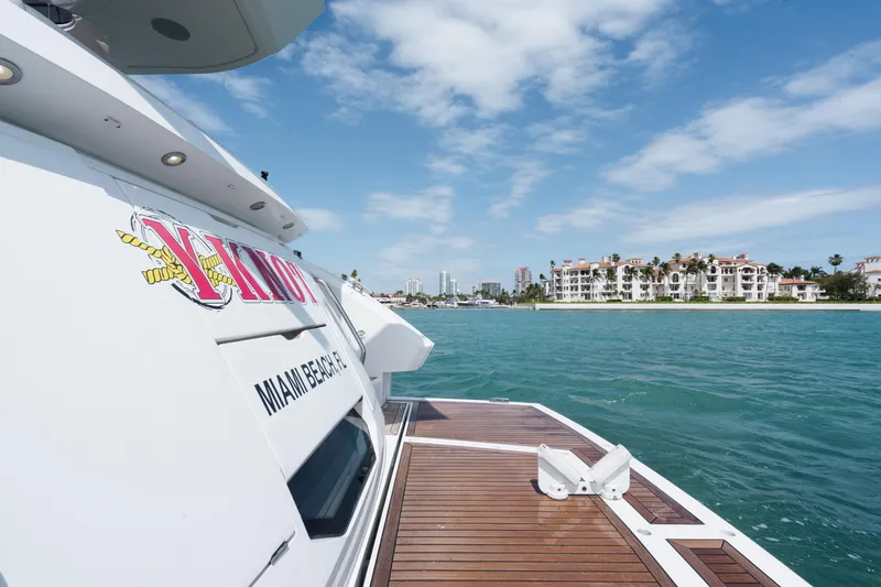 Slide: The Image of Sunseeker 52 Manhattan yacht cruising near Miami Beach, 2020 model, with scenic waterfront view. - 40