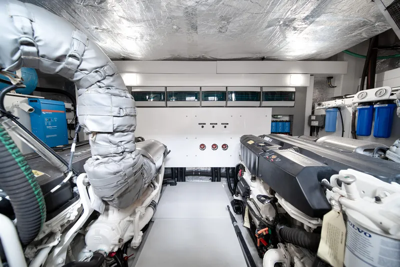 Slide: The Image of Engine room of 2020 Sunseeker 52 Manhattan yacht, showcasing advanced machinery and equipment. - 41