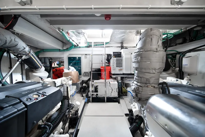 Slide: The Image of Engine room of 2020 Sunseeker 52 Manhattan yacht, showcasing advanced machinery and equipment. - 42