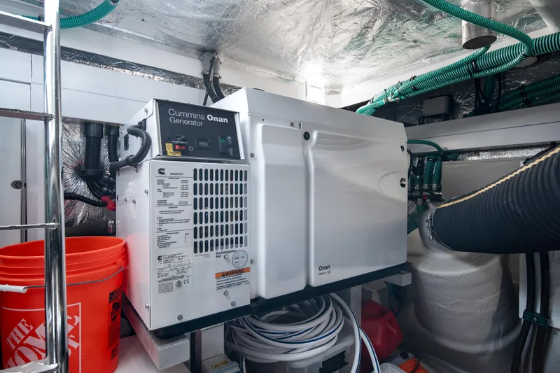Slide: The Image of Engine room of 2020 Sunseeker 52 Manhattan with Cummins Onan generator. - 44