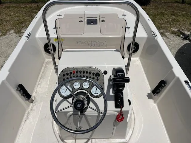 Slide: The Image of 2025 Carolina Skiff 178 JLS boat console with steering wheel and control panel. - 5