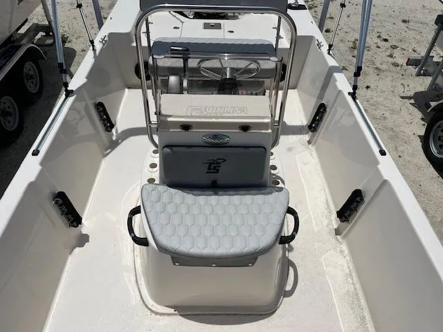 Slide: The Image of 2025 Carolina Skiff 178 JLS boat interior with seating and steering console. - 9
