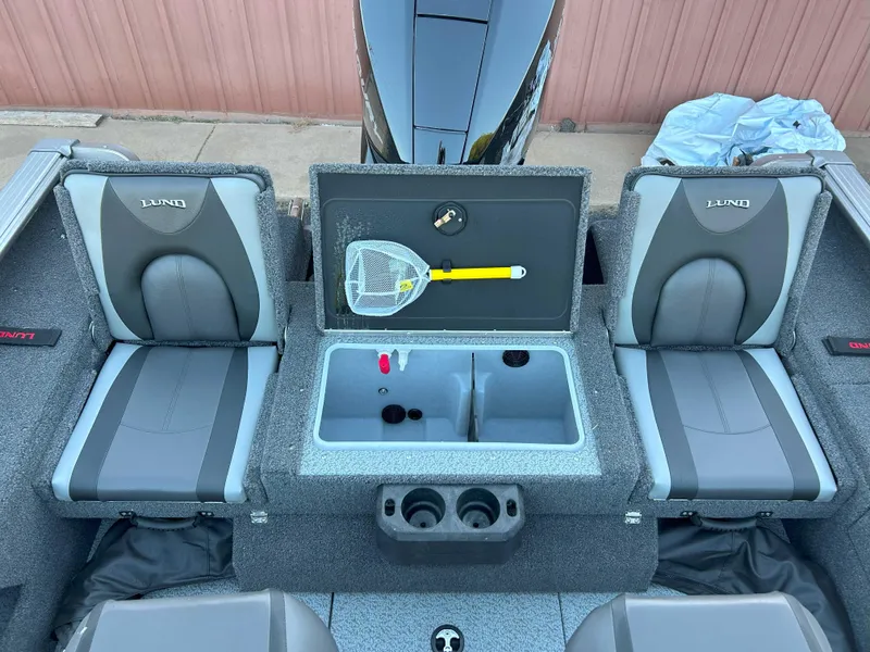 Slide: The Image of 2025 Lund 2075 IMPACT XS boat interior with seating and storage compartments. - 5