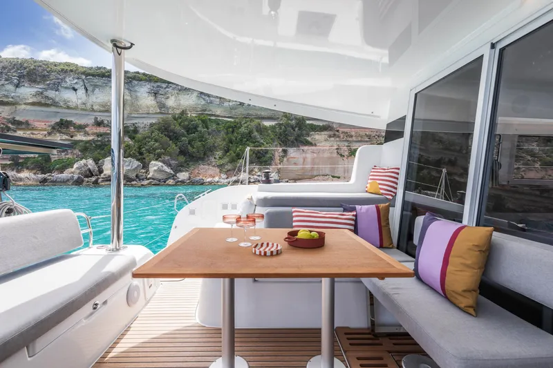 Slide: The Image of Luxurious Lagoon 38 catamaran interior with scenic ocean view, 2025 model. - 16