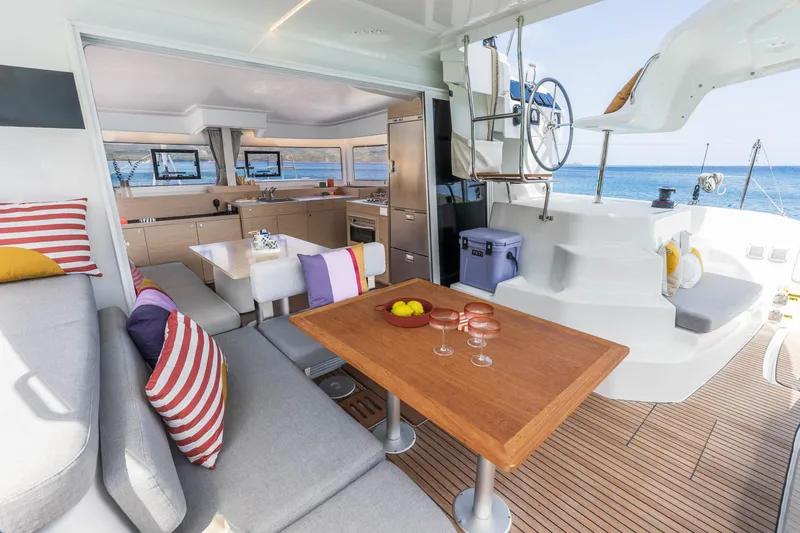 Slide: The Image of Luxurious 2025 Lagoon 38 yacht interior with modern kitchen and seating area. - 21