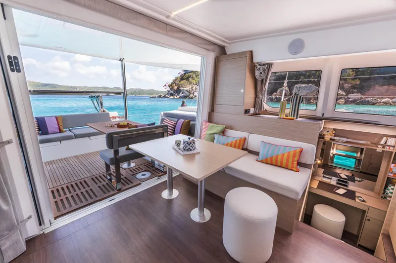 Slide: The Image of Luxurious interior of 2025 Lagoon 38 catamaran with ocean view and colorful decor. - 34