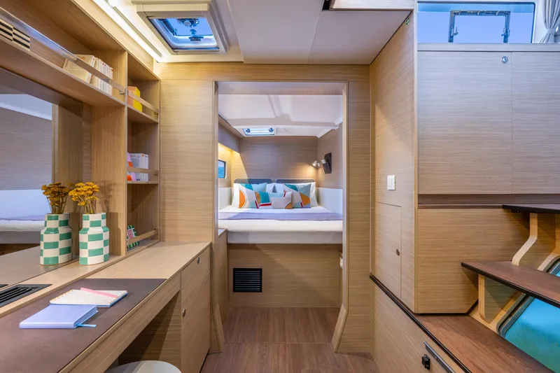 Slide: The Image of Luxurious interior of 2025 Lagoon 38 catamaran with modern design and cozy bedroom. - 40