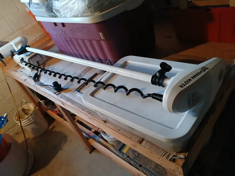 Slide: The Image of Minn Kota trolling motor on a workbench, suitable for Angler 22 Center Console 2001 boat. - 14