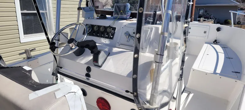 Slide: The Image of 2001 Angler 22 Center Console boat interior with steering wheel and control panel. - 5