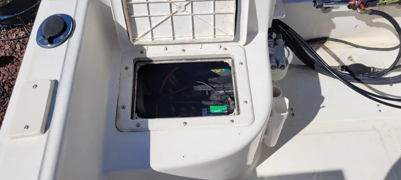 Slide: The Image of Battery compartment of 2001 Angler 22 Center Console boat, open with visible wiring. - 9