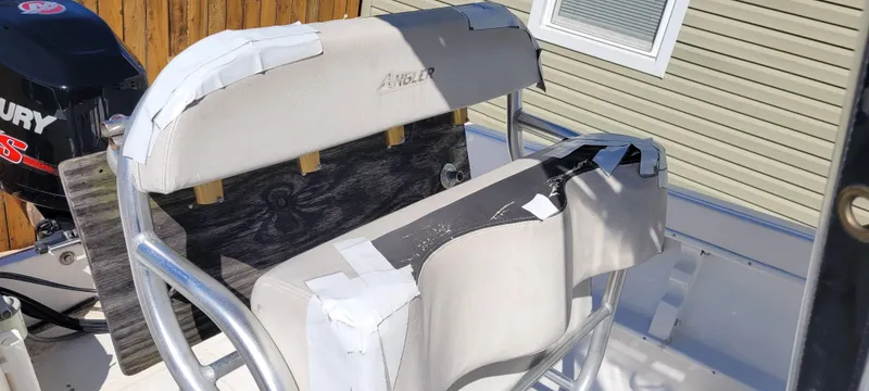Slide: The Image of 2001 Angler 22 Center Console boat seat with taped repairs. - 10