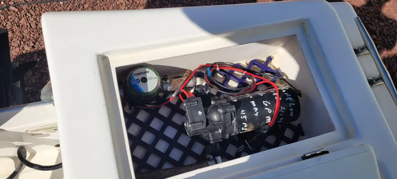 Slide: The Image of 2001 Angler 22 Center Console boat compartment with wiring and equipment. - 18