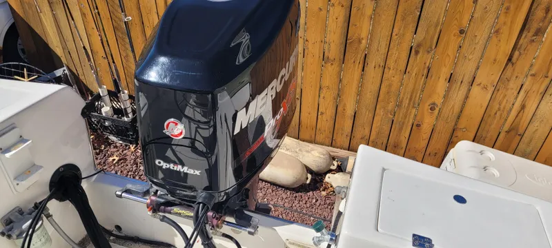 Slide: The Image of 2001 Angler 22 Center Console boat with Mercury OptiMax outboard motor. - 3