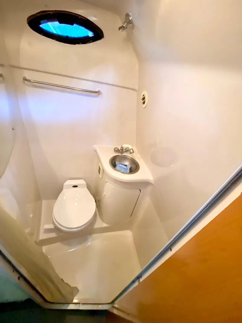 Slide: The Image of 2001 Regal 2660 COMMODORE boat bathroom with toilet and sink. - 18