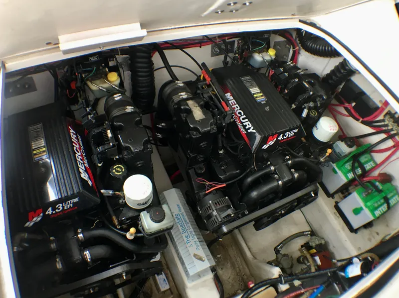 Slide: The Image of Twin Mercury 4.3L engines in a 2001 Regal 2660 COMMODORE boat. - 19