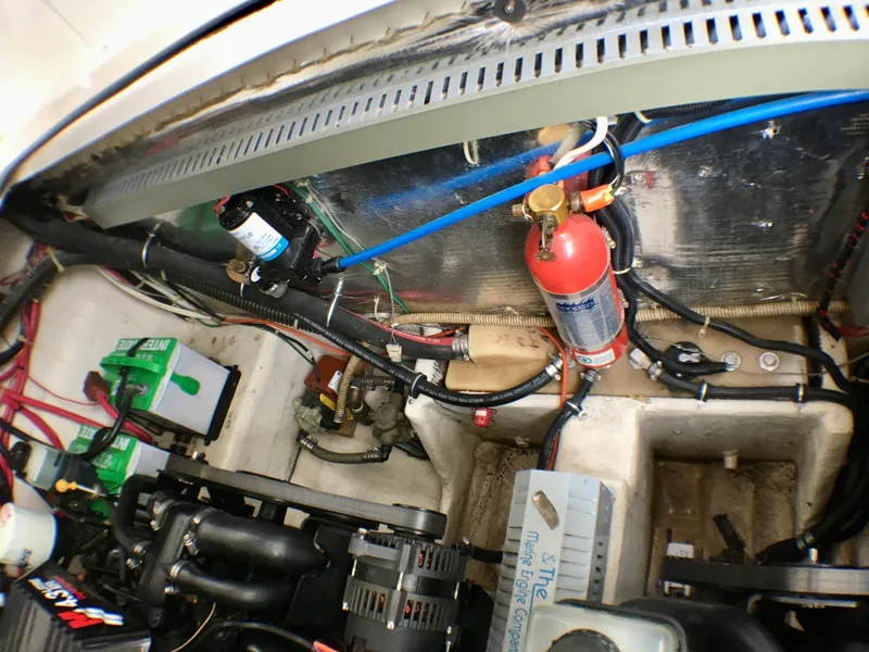 Slide: The Image of Engine compartment of a 2001 Regal 2660 COMMODORE boat, showing mechanical components and wiring. - 20