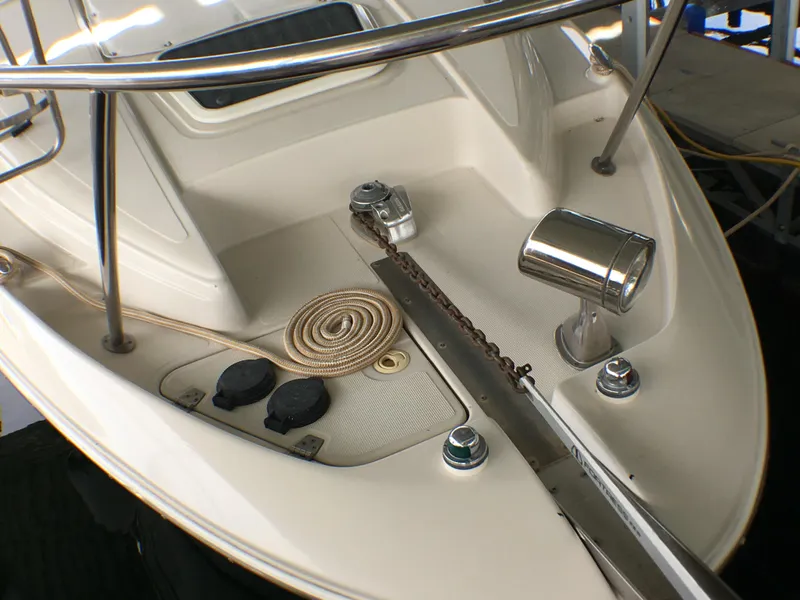 Slide: The Image of 2001 Regal 2660 COMMODORE boat deck with anchor chain and coiled rope. - 21