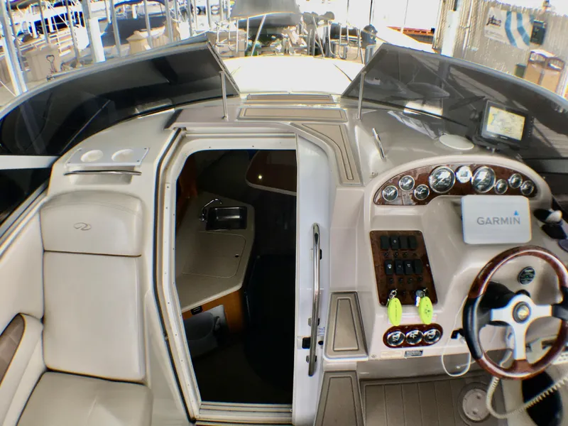 Slide: The Image of 2001 Regal 2660 Commodore boat interior with Garmin navigation system and control panel. - 9