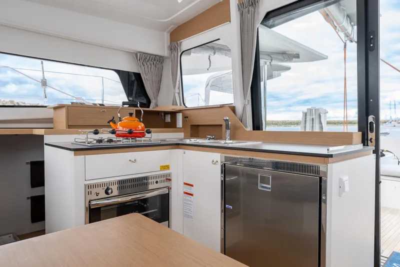 Slide: The Image of Modern kitchen interior of 2025 Excess 11 yacht with stove, sink, and scenic window view. - 21