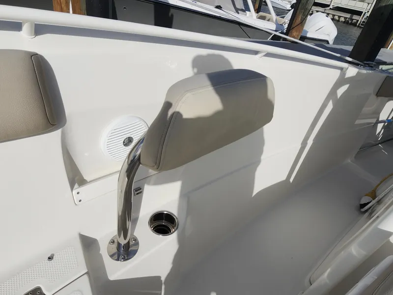 Slide: The Image of 2018 Sailfish 270 CC boat interior with seating and speaker detail. - 15