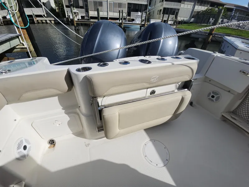 Slide: The Image of 2018 Sailfish 270 CC boat interior with dual engines and seating area. - 17