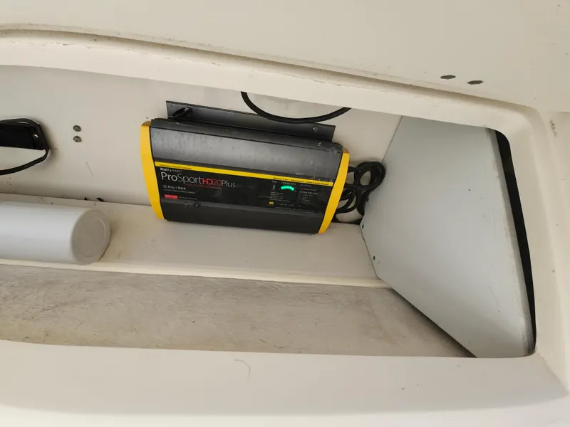 Slide: The Image of 2018 Sailfish 270 CC boat compartment with ProSportHD20Plus battery charger. - 20